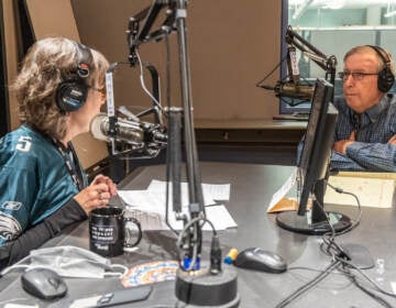 WHYY’s Mary Cummings-Jordan talks with sports commentator Ray Didinger about Super Bowl LVII at WHYY studios in Philadelphia. (Kimberly Paynter/WHYY)