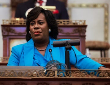 Mayor Parker looks on