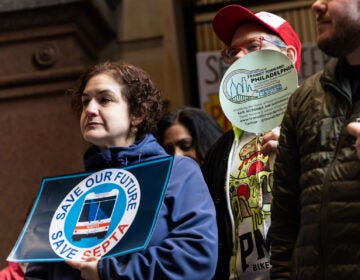 protesters hold signs, one reading SAVE OUR FUTURE SAVE SEPTA