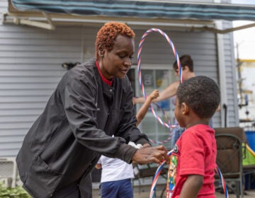 Malaika Felts with a child