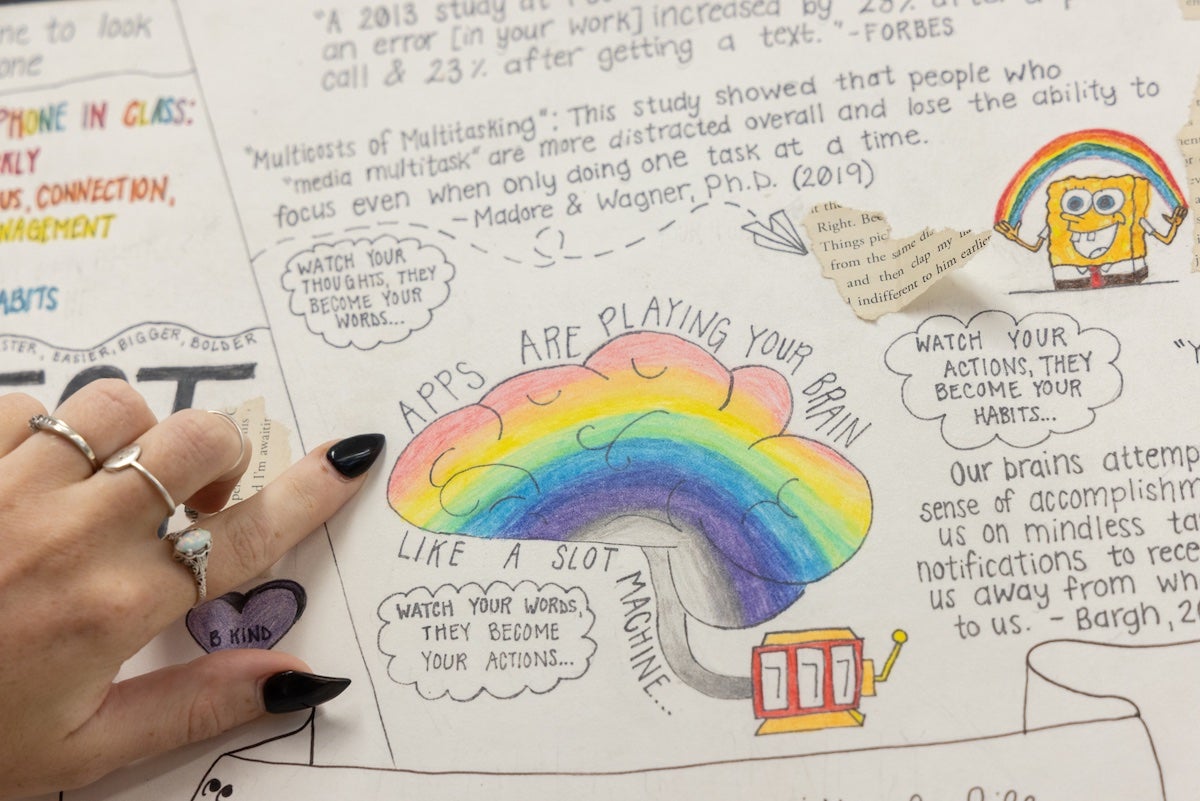 Handmade posters in the classroom of English and journalism teacher Kate Conroy explains to students some benefits of learning without technology. (Kimberly Paynter/WHYY)