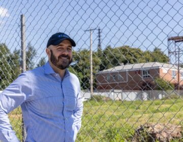 Philip Balderston posing for a photo near the lot that will be developed