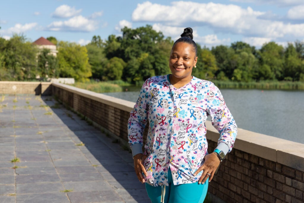 A woman posing for a photo outdoors