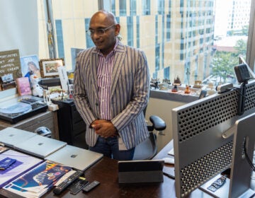 Veenu Aishwarya, founder and CEO of AUM LifeTech, stands in his office