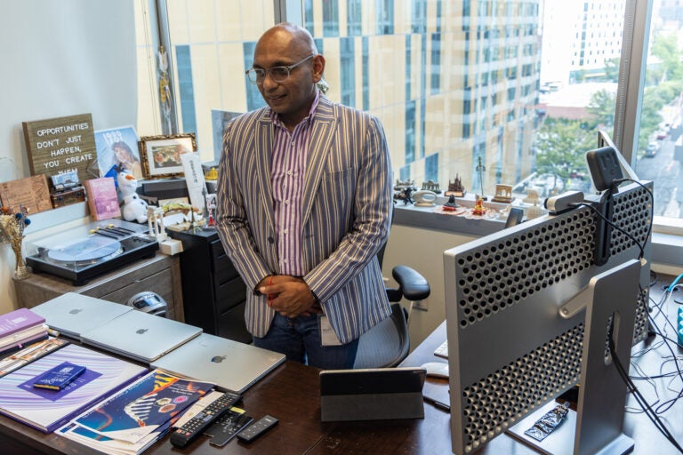 Veenu Aishwarya, founder and CEO of AUM LifeTech, stands in his office