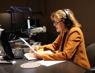 Marty Moss-Coane sits behind the mic at the Radio Times studio