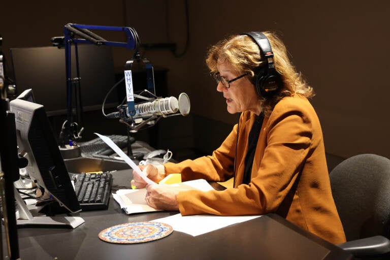 Marty Moss-Coane sits behind the mic at the Radio Times studio