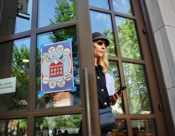 A voter leaves her polling place at the Museum of the American Revolution in Philadelphia after voting in the 2025 primary election