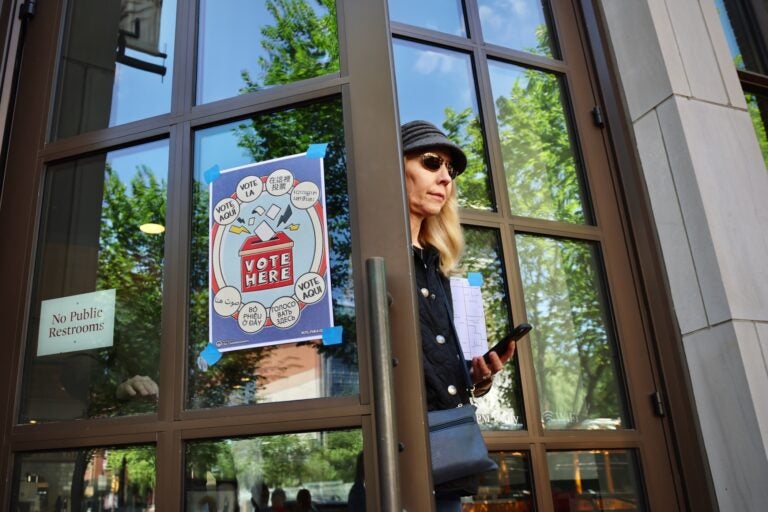 A voter leaves her polling place at the Museum of the American Revolution in Philadelphia after voting in the 2025 primary election