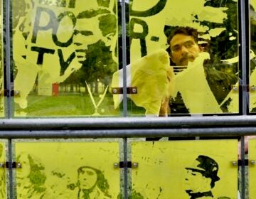 Nicolo Gentile touches up his ''Bar None'' installation at Maja Park