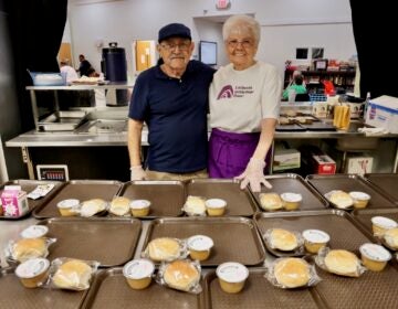 Thomas Homer (left) and Marge Wible (right) volunteering at Lutheran Settlement House