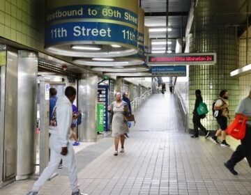 People milling about in the interchange hallway of a SEPTA station