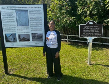 Linda Shockley smiles outside the Peter Mott House