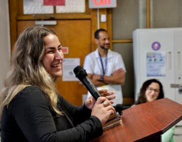 Diamond Stahl speaking into a microphone