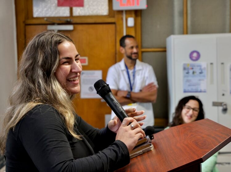 Diamond Stahl speaking into a microphone