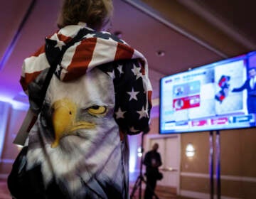 A person wearing an eagle on the back of their hoodie watches the incoming results for New Jersey at the election night party for Republican gubernatorial candidate Jack Ciattarelli, held at the Bridgewater Marriott hotel in Bridgewater, N.J., Tuesday, Nov. 2, 2021