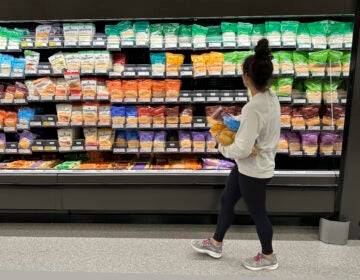 A shopper peruses cheese offerings at a Target store in Sheridan, Colo. (AP Photo/David Zalubowski, File)