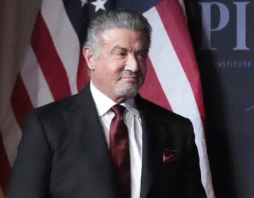 Sylvester Stallone wears a suit