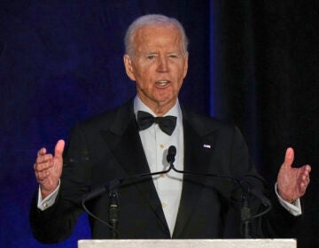 Former President Joe Biden speaks at a podium