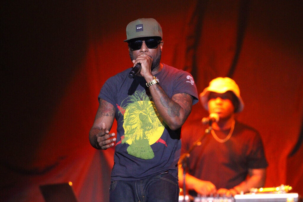 Rapper Talib Kweli performing on stage