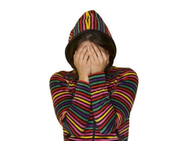 a teenage girl with shame isolated on white