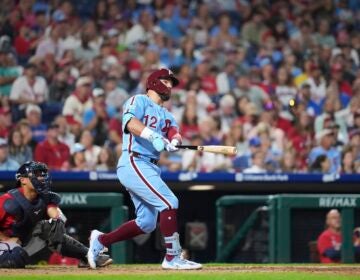 Kyle Schwarber watches after hitting a two-run home run