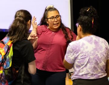 A speaker from the Breakthrough program speaks to students in the program.