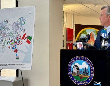 Wilmington Mayor John Carney refers to a map where the poorest neighborhoods in the city, in red, were feeling the brunt of property tax hikes