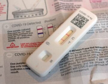A COVID-19 antigen home test indicating a positive result