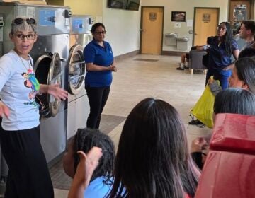 Neyda Albarrán and kids at a Culture Club PR event in a laundromat
