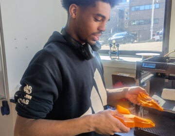 A Drexel student demonstrates how 3D printing can be used to make shoes
