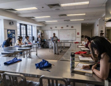 Students work in a library classroom