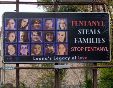 a billboard reads FENTANYL STEALS FAMILIES STOP FENTANYL