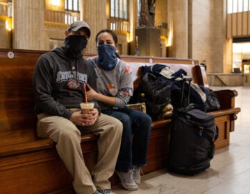 Gloriana Berry (right) and Kent Berry sit at 30th Street Station