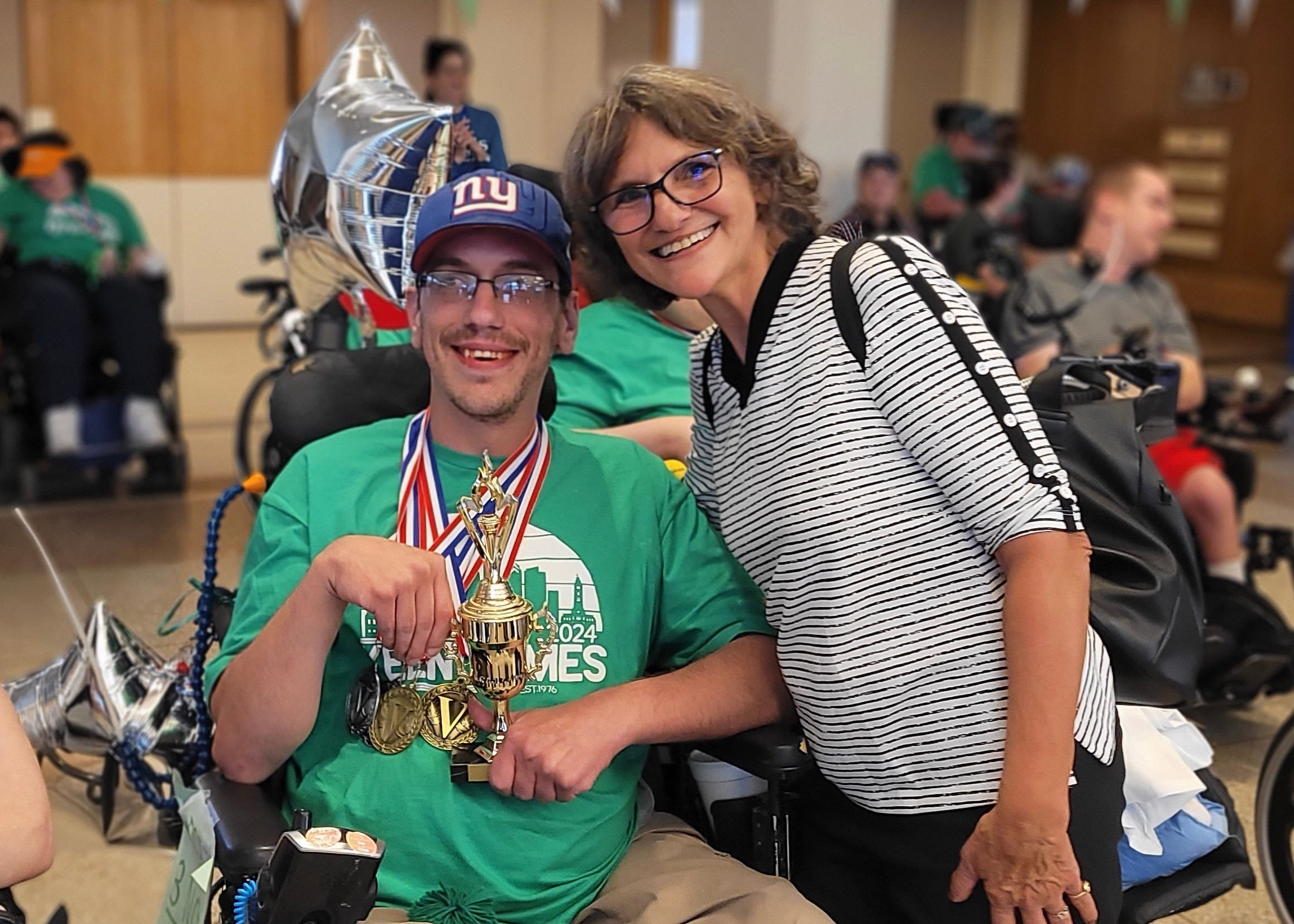 Aaron Deede and his mother, Ann Phillips, smile