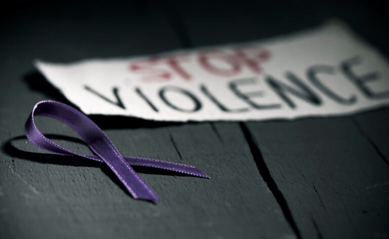 A purple ribbon for the awareness about the unacceptability of the violence against women