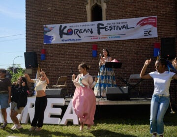 Adah Cho (pictured rear), acting at the event’s emcee
