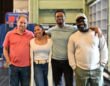 Members of a theater company pose for a photo