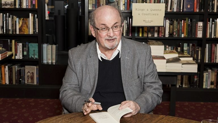 Author Salman Rushdie poses for photographers at a book signing in London, Tuesday, June 6, 2017. (Grant Pollard/Invision/AP)