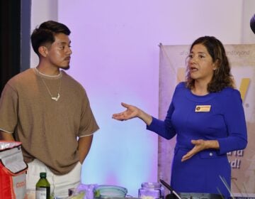 Guadalupe Castañeda talks with Johnny Perez-Gonzalez