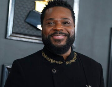 Malcolm-Jamal Warner smiles