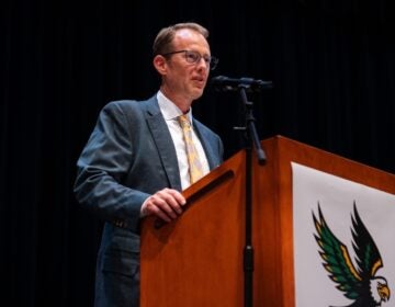 Matthew Burrows speaking at a podium