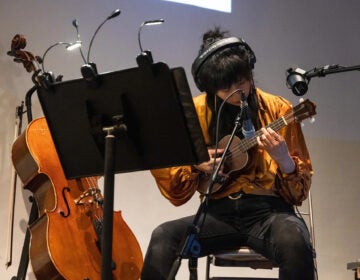 Melanie Hsu plays a ukulele