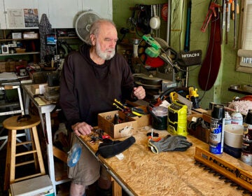 A man works in his workshop in Delaware
