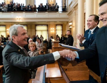 New Jersey Gov. Phil Murphy meets with Senate President Nicholas Scutari, right, and Assembly Speaker Craig Coughlin, second right, before he delivers his State of the State address to a joint session of the Legislature at the statehouse, in Trenton, N.J., Tuesday, Jan. 10, 2023.