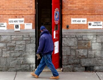 A man walks into a polling place at a Hoboken Fire Department firehouse during Election Day