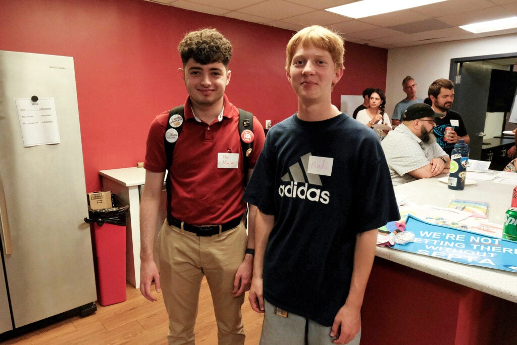 Two students posing for a photo at the event