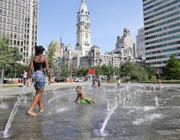 Children cooling off in a public fountain in LOVE Park