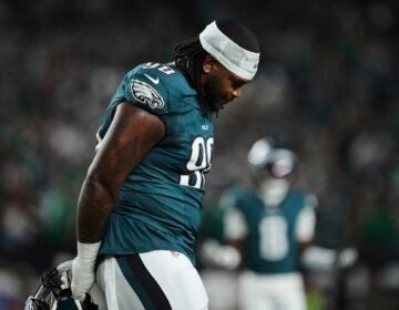 Philadelphia Eagles defensive tackle Jalen Carter walks off the field after being disqualified for unsportsman like conduct before an NFL football game against the Dallas Cowboys Thursday, Sept. 4, 2025, in Philadelphia.