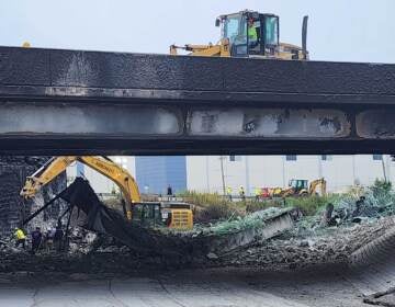 Crews work on I-95, where a section of highway collapsed from a tanker fire.